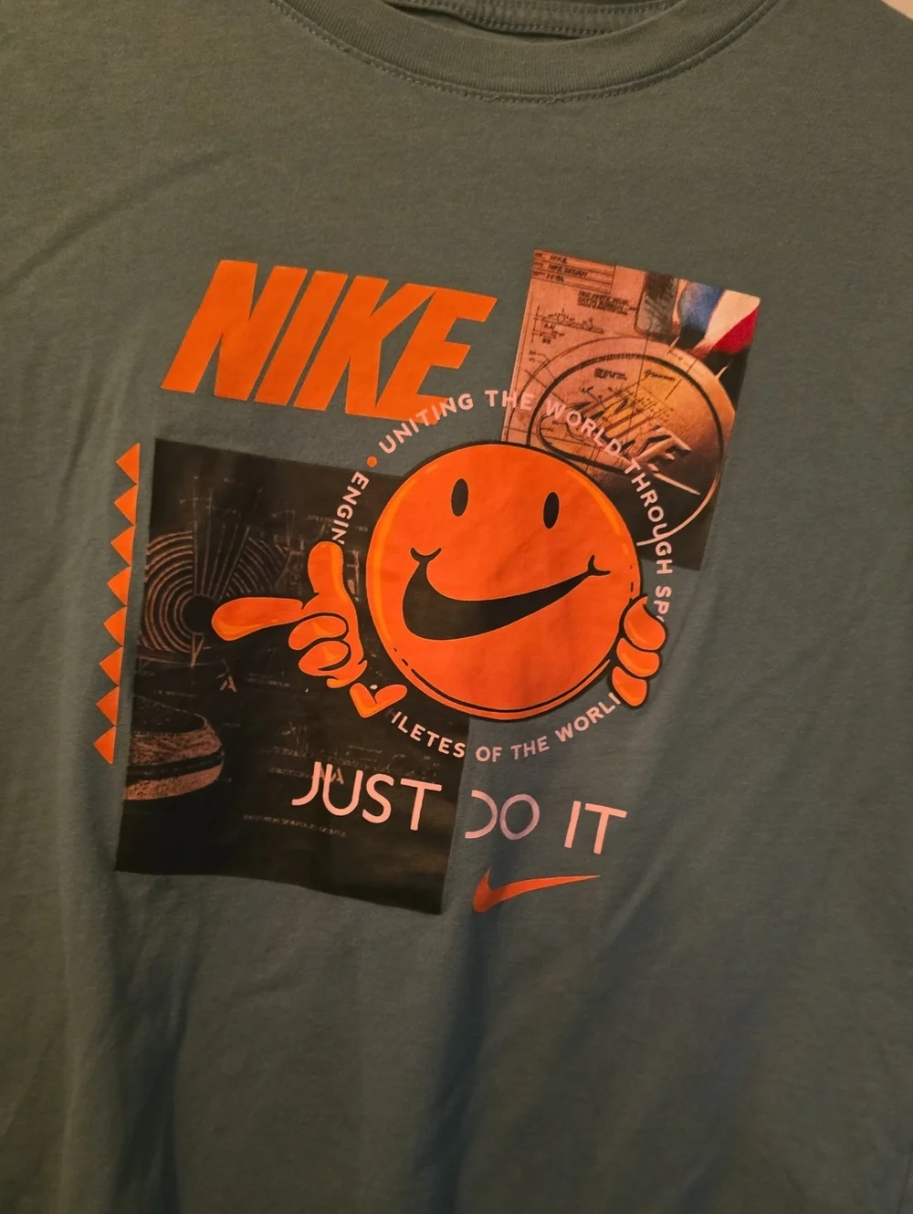 Nike Kids Green Graphic Tee with Orange Logo